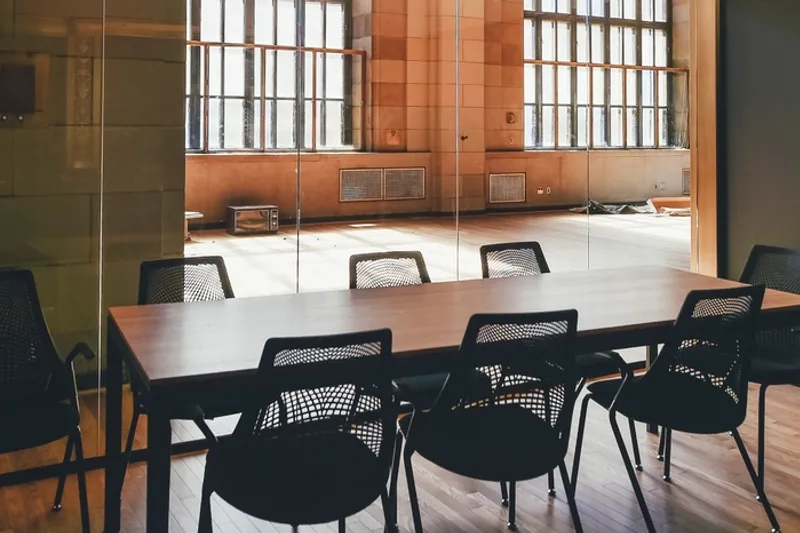 A negotiation under way across a boardroom table
